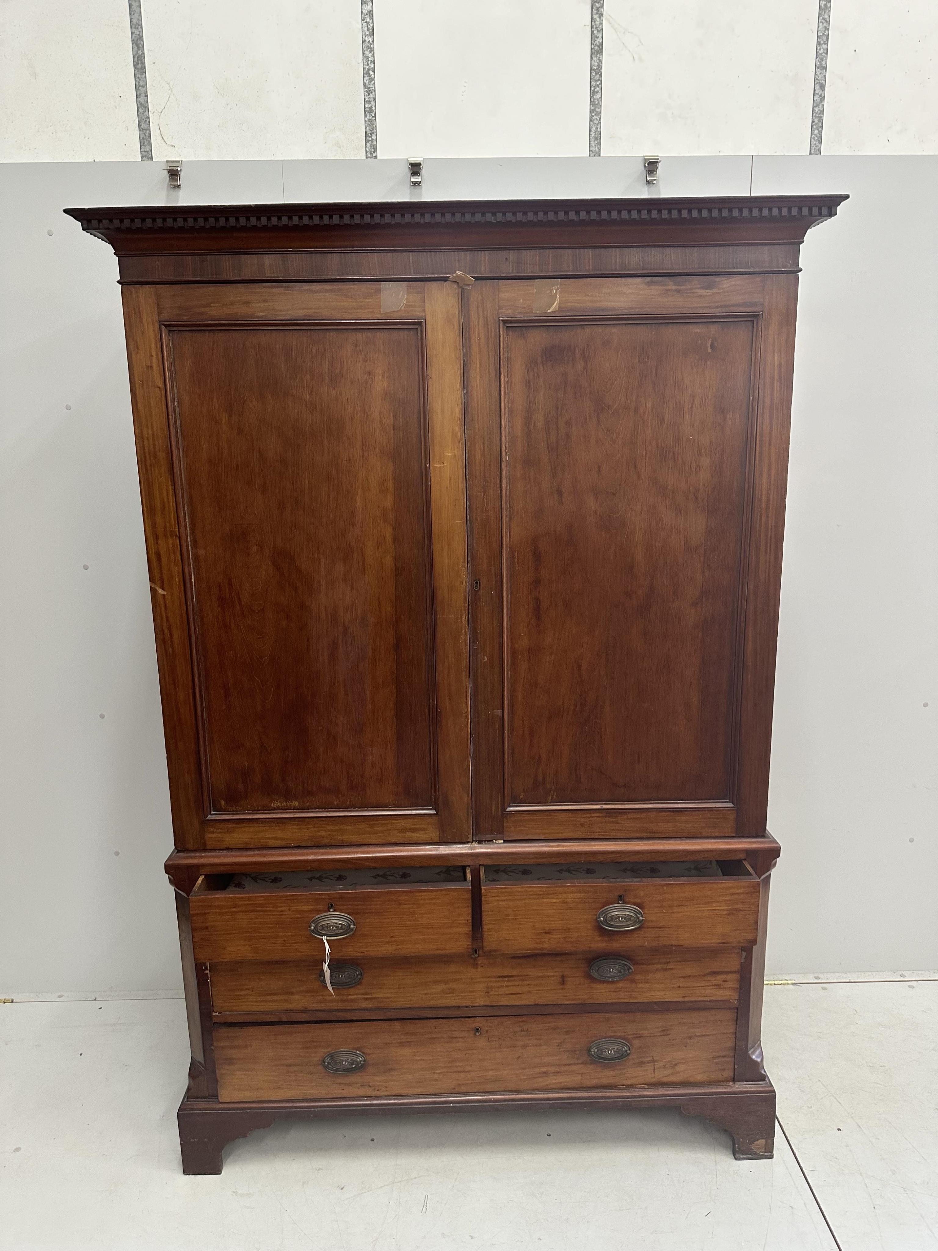 A George IV mahogany linen press, width 138cm, depth 47cm, height 212cm. Condition - poor